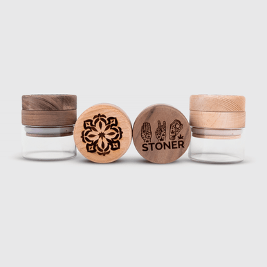 SmoakJar showing wooden grinder lid integrated with glass storage jar
