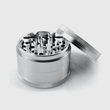 Custom large zinc grinders with various branded designs.