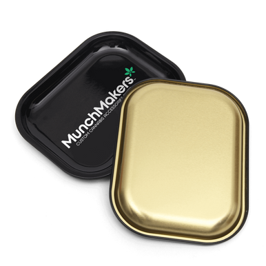 Custom tin rolling trays with various creative branded designs.
