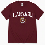 Maroon Gildan unisex Harvard University T-shirt featuring white Harvard lettering, crest and Est. 1636 design.