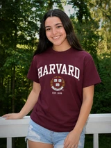 Maroon Gildan unisex Harvard University T-shirt featuring white Harvard lettering, crest and Est. 1636 design.