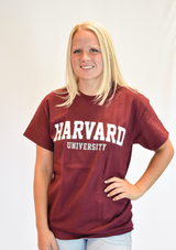 Gildan unisex Harvard University Outline T-shirt with bold collegiate Harvard lettering, available in Maroon, Sport Grey and Charcoal.