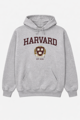 Shop the Harvard University sport grey hoodie featuring the iconic crest and Est. 1636. Soft, fleece, unisex fit, and classic collegiate style.