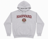 Shop the Harvard University sport grey hoodie featuring the iconic crest and Est. 1636. Soft, fleece, unisex fit, and classic collegiate style.