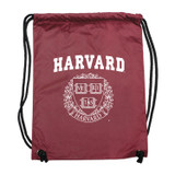 Harvard maroon drawstring back sack with white Harvard logo and Veritas crest