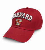 Shop the officially licensed Harvard embroidered baseball cap in maroon. Features raised Harvard lettering and shield detail with an adjustable fit for everyday wear.