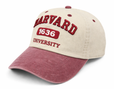Natural and maroon Harvard University cap with embroidered Harvard lettering, 1636 design and University detail.