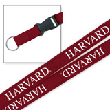 Harvard 3/4 inch crimson woven lanyard with white Harvard lettering, detachable buckle, and metal key ring.