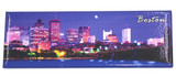 Panoramic Boston souvenir magnet featuring the illuminated city skyline at night along the Charles River.