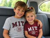 Kids Gildan MIT youth T-shirt available in Maroon and Sport Grey featuring the Massachusetts Institute of Technology seal.