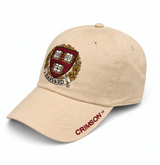 Harvard Shield Crimson adjustable cap with embroidered shield logo and curved brim in putty.