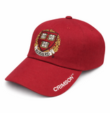 Harvard Shield Crimson adjustable cap with embroidered shield logo and curved brim in maroon.