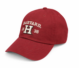 Harvard embroidered adjustable cap with varsity H and 1636 detail in maroon, charcoal, and white.