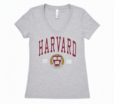 Officially licensed Harvard Ladies Ideal V-Neck T-shirt by Next Level in Sport Grey featuring the Harvard Crest and Est. 1636 graphic. Women's sizes S–XL with a slim fit.