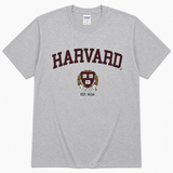 Sport Grey Gildan unisex Harvard University T-shirt featuring maroon Harvard lettering, crest and Est. 1636 design.