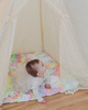 A soft cuddle pastel rainbow tie dye fabric handtufted with premium polyester fiberfill.