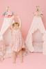 This tent is a pink candy stripe cotton fabric. The doors have a beautiful hand crafted ruffle.