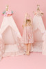 This tent is a pink candy stripe cotton fabric. The doors have a beautiful hand crafted ruffle.