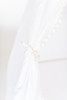 This tent is all white is made of 100% twill cotton fabric and the doors have white pom pom trim.