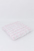A light pink gingham/buffalo check cotton fabric.