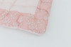 Pink candy stripe cotton fabric with pink lace around the edges.