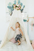 This tent is cream and it is made of 100% pima cotton fabric. The doors are made with a gorgeous eyelash lace with cream pom pom trim.