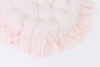 A circle shaped mattress in pink candy stripe cotton fabric with a gorgeous hand crafted ruffle around the edges.