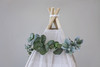 This floral topper is filled with eucalyptus, lambs ear, and baby's breath silk florals.