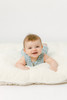 An ivory sherpa fabric that has a lambie textured, super-soft surface