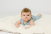 An ivory sherpa fabric that has a lambie textured, super-soft surface