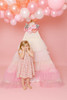 This tent is a cream pima cotton fabric with layers of cream and shades of pink tulle.