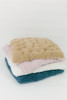 A very soft cuddle llama fur fabric in color rosewater (mauve).