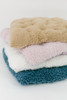 A very soft cuddle llama fur fabric in color rosewater (mauve).