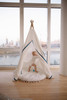 The Tyler Play Tent is very neutral but ready for adventure. This all white play tent is made from 100% premium cotton (OEKO-TEX certified) and denim blue colored binding. The play tent comes with tie back doors. It has four wooden poplar rods that hold up a beautifully crafted play tent.