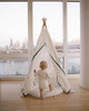 The Tyler Play Tent is very neutral but ready for adventure. This all white play tent is made from 100% premium cotton (OEKO-TEX certified) and denim blue colored binding. The play tent comes with tie back doors. It has four wooden poplar rods that hold up a beautifully crafted play tent.