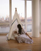 The Tyler Play Tent is very neutral but ready for adventure. This all white play tent is made from 100% premium cotton (OEKO-TEX certified) and denim blue colored binding. The play tent comes with tie back doors. It has four wooden poplar rods that hold up a beautifully crafted play tent.