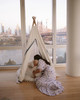 The Tyler Play Tent is very neutral but ready for adventure. This all white play tent is made from 100% premium cotton (OEKO-TEX certified) and denim blue colored binding. The play tent comes with tie back doors. It has four wooden poplar rods that hold up a beautifully crafted play tent.