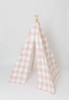 A dark blush pink gingham/buffalo plaid play tent.