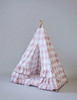 The Bonnie Play Tent is a dark blush pink gingham/buffalo plaid play tent with 3 sets of horizontal ruffles
