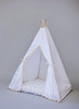 The Skylar tent is made from white twill cotton with cream pom poms on the front panels.