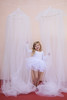The Tulle canopy is handsewn using 15 yards of the finest crafted tulle available.