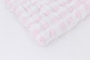 A light pink gingham/buffalo check cotton fabric.