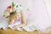 A circle mattress made of all white twill cotton fabric with a beautifully handcrafted ruffle around the edges.