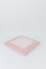 Pink candy stripe cotton fabric with pink lace around the edges.