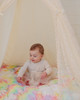 A soft cuddle pastel rainbow tie dye fabric handtufted with premium polyester fiberfill.