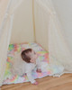 A soft cuddle pastel rainbow tie dye fabric handtufted with premium polyester fiberfill.