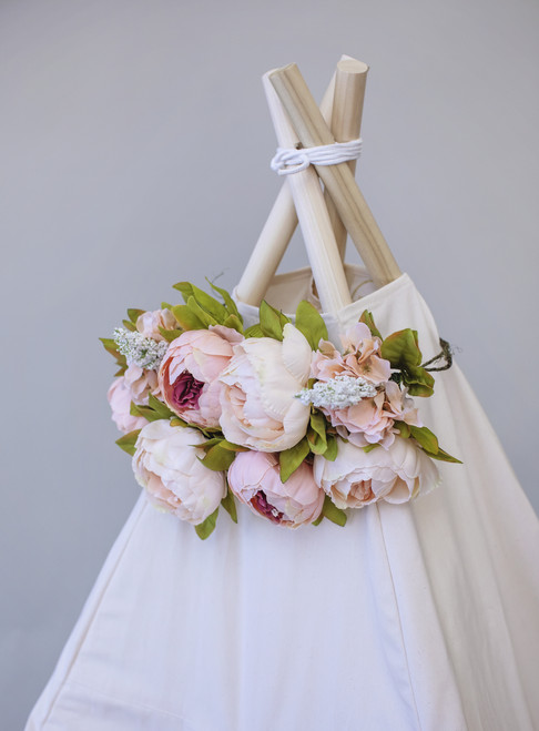 A double layer, peony floral topper in blush color tones.