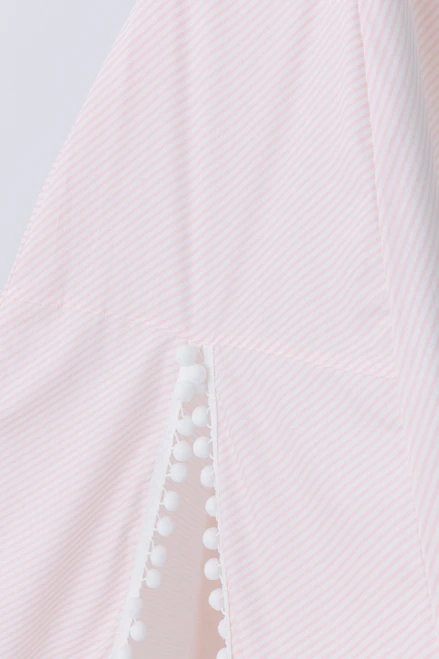 This tent has light pink diagonal stripes, white pom pom trim and it is made of 100% premium cotton fabric.