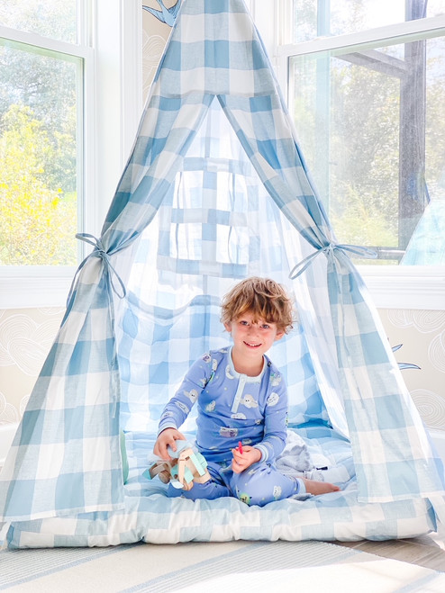 This tent is made of a light blue buffalo check (also known as gingham) and it is made of 100% cotton twill fabric.