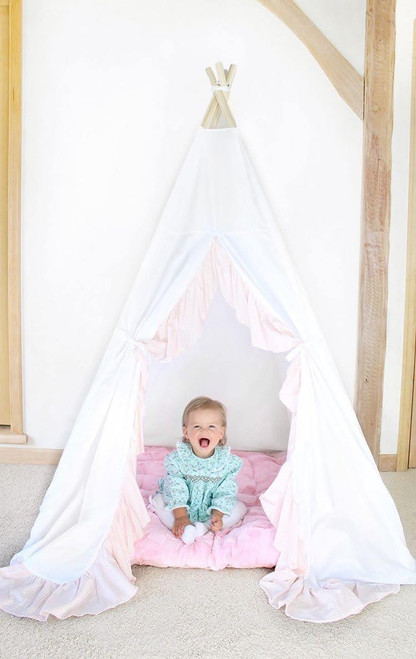 This all white play tent is made from 100% premium pima cotton (OEKO-TEX certified). The play tent comes with a pink handcrafted ruffle down the doors.